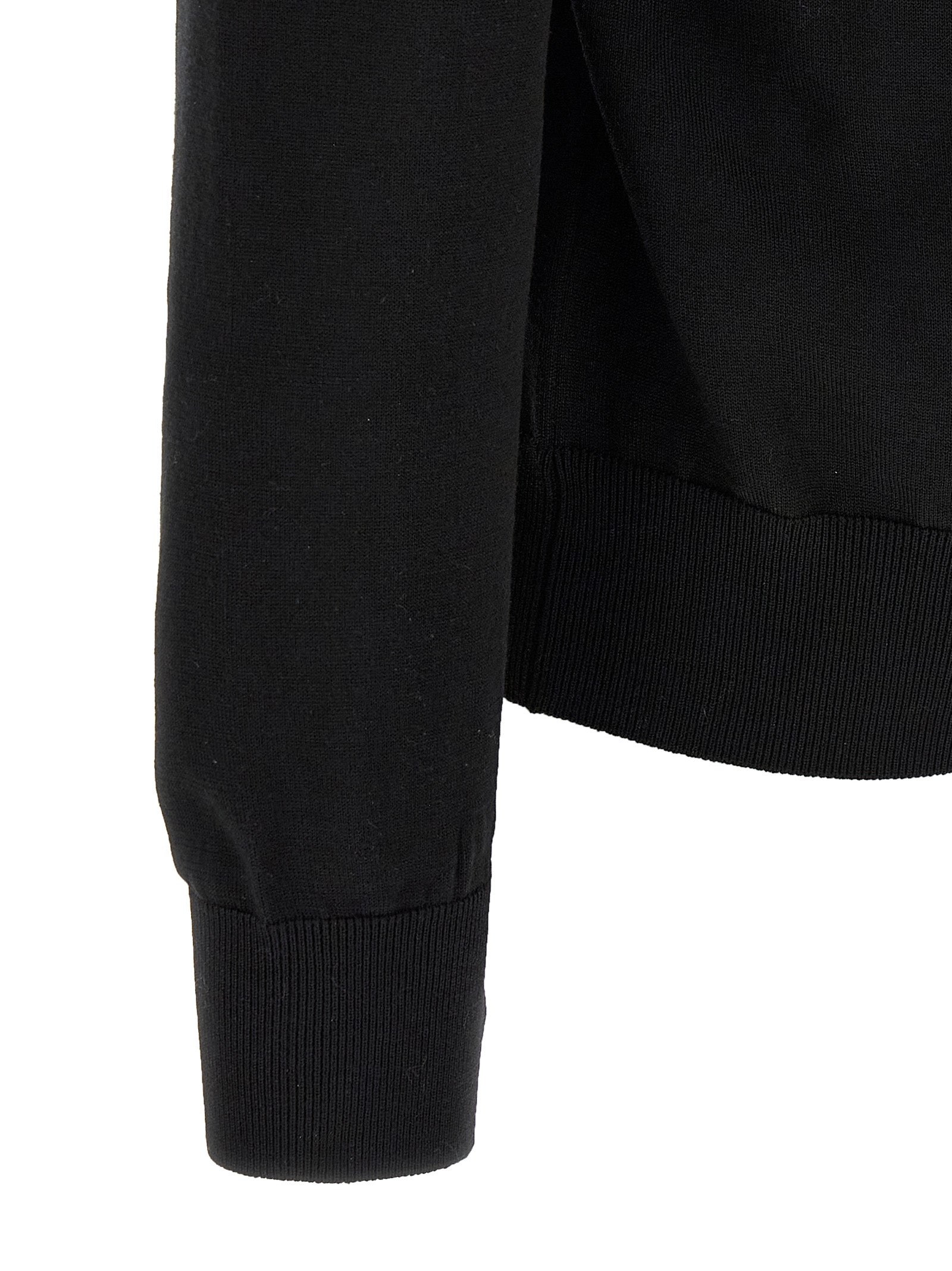 Cardigan en laine vierge noire Dolce & Gabbana, doux et élégant, porté sur un mannequin.