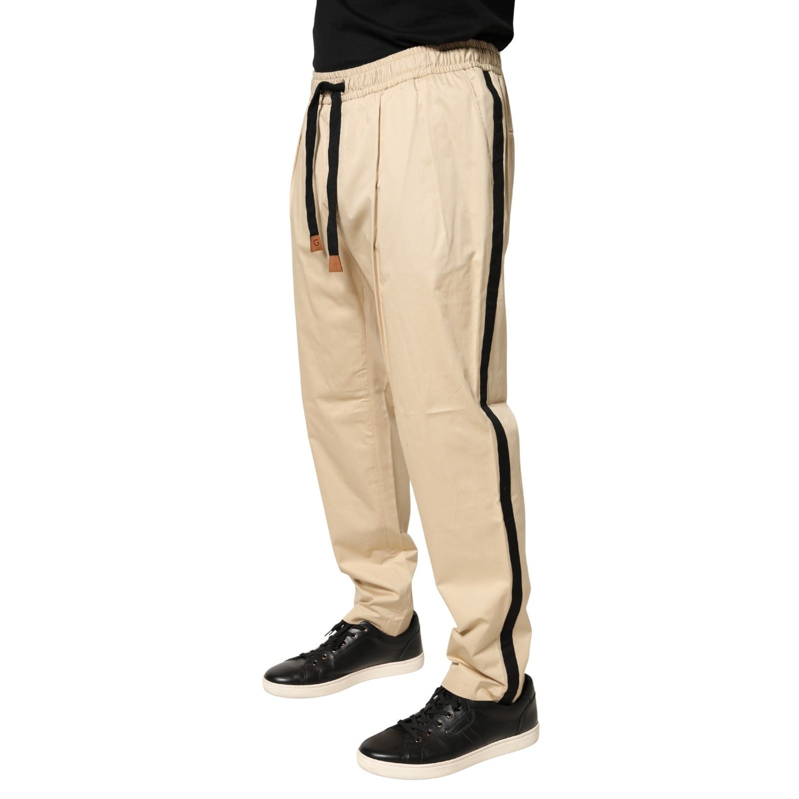 Pantalon jogger skinny beige en coton pour homme de Dolce & Gabbana, coupe ajustée et style décontracté.