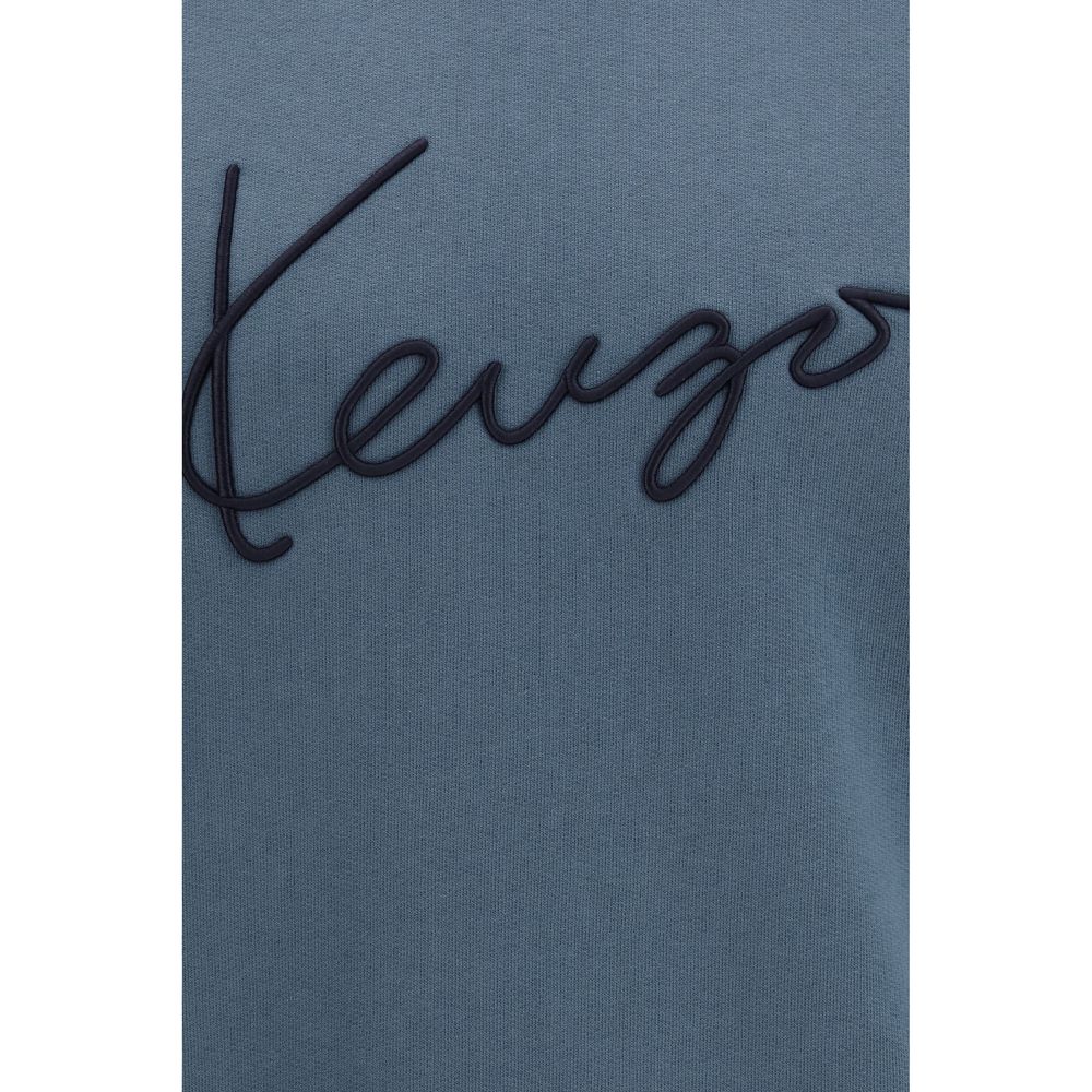 Sweatshirt en coton bleu Kenzo avec logo imprimé, style décontracté, porté par un mannequin.