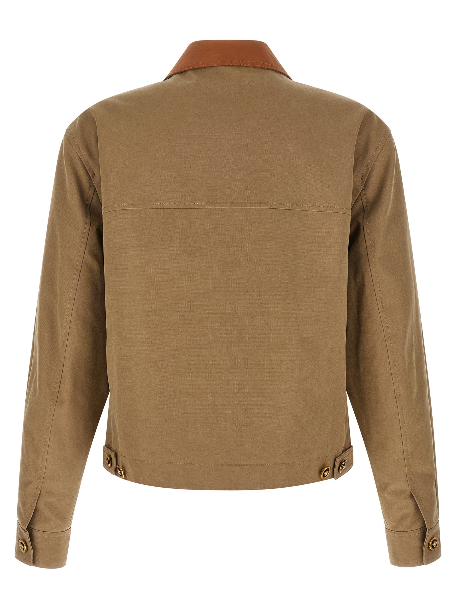 Veste en coton beige Versace, style élégant, avec logo emblématique, portée sur un mannequin.