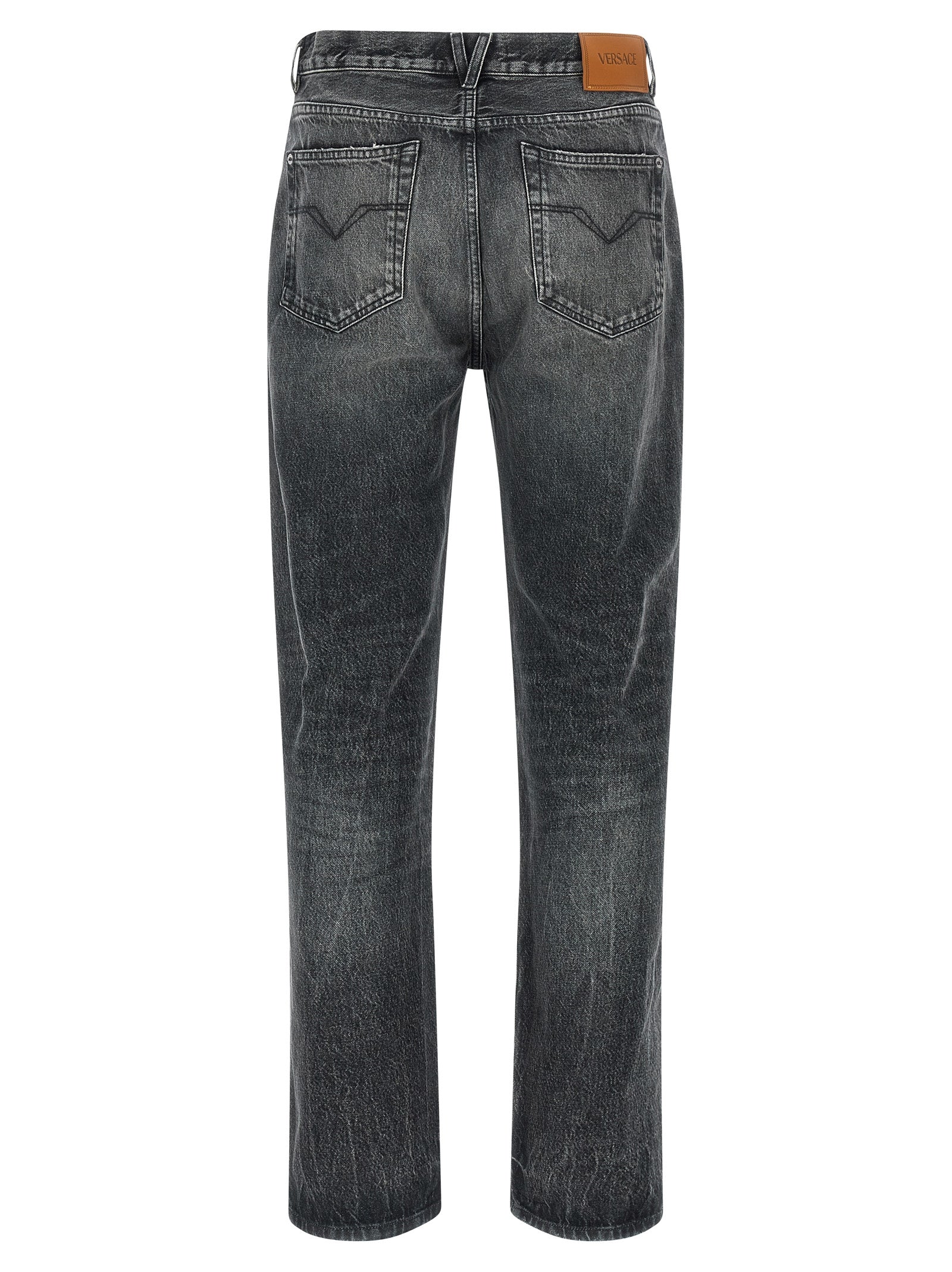 Jeans droits gris en coton de la marque Versace, vue de face, avec détails de couture visibles.