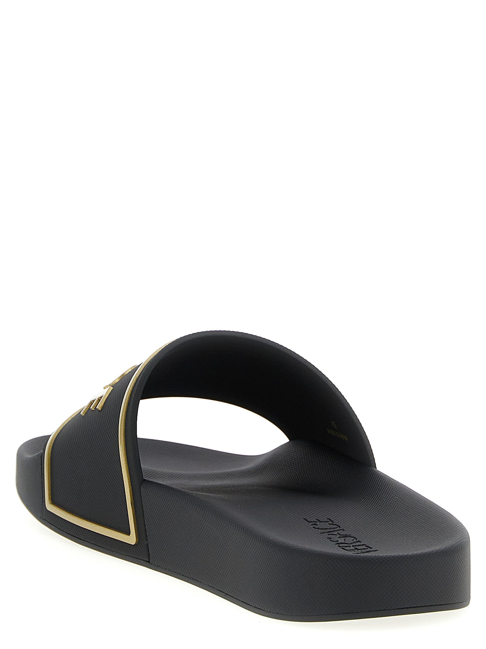 Sandales en polyuréthane noires Versace avec logo emblématique, confortables et élégantes pour un style sophistiqué.