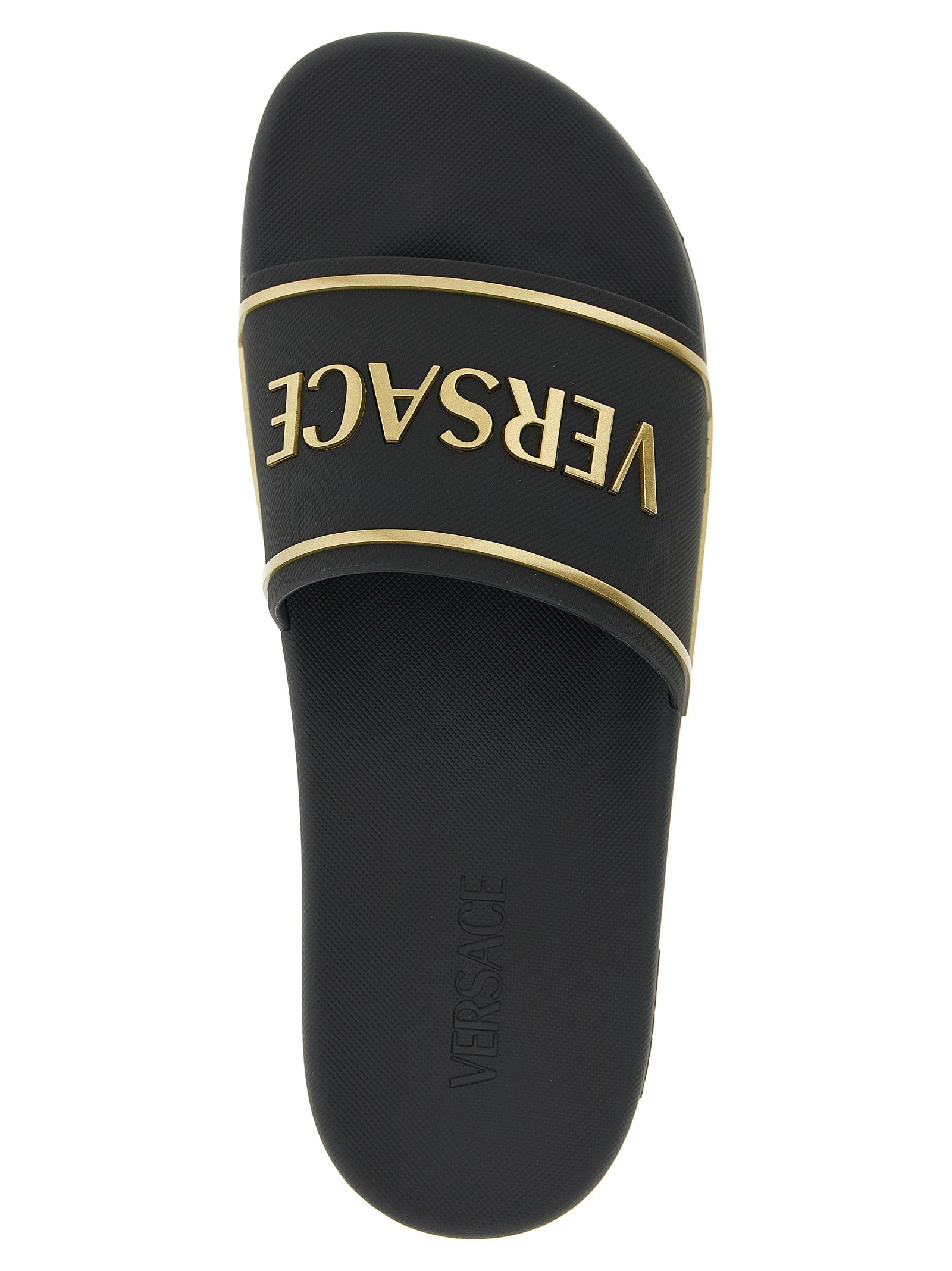 Sandales noires en polyuréthane de la marque Versace, avec logo emblématique et design élégant.