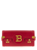Sac clutch en cuir de veau fuchsia Balmain, élégant et structuré, avec détails sophistiqués pour une touche de luxe.
