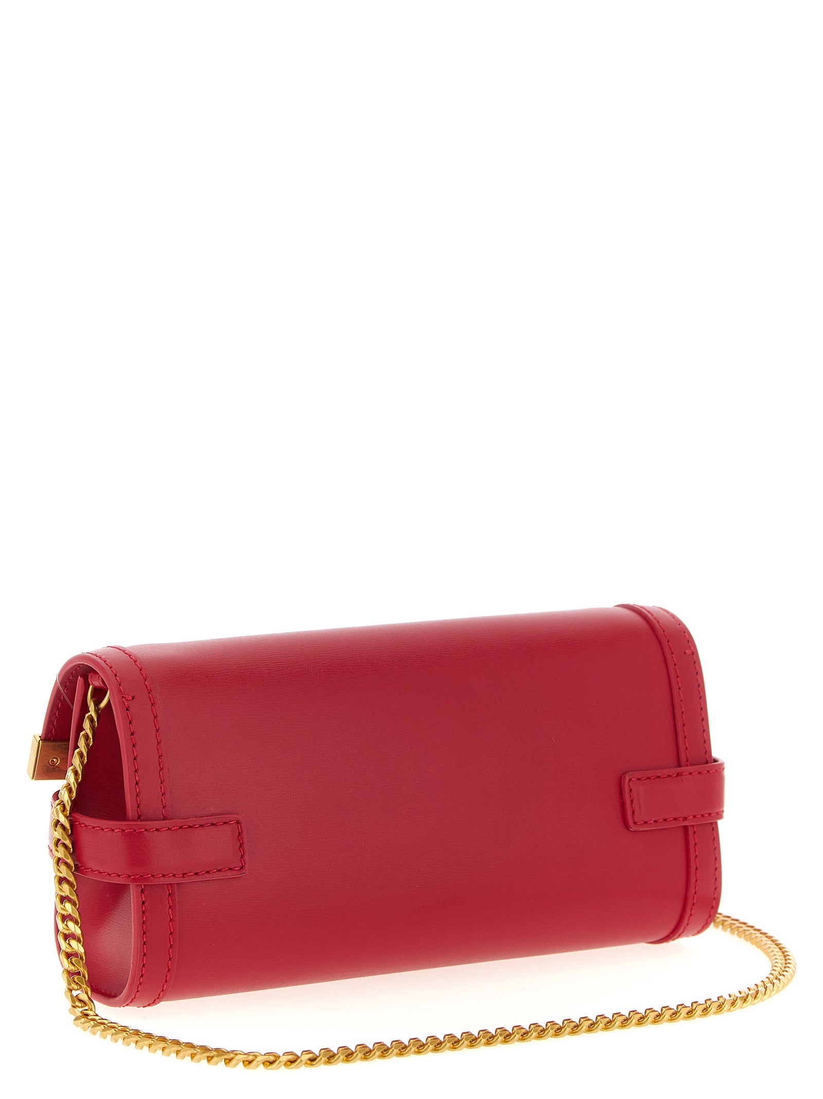Sac clutch en cuir de veau fuchsia de Balmain, avec détails élégants et design sophistiqué, visible en première plan.