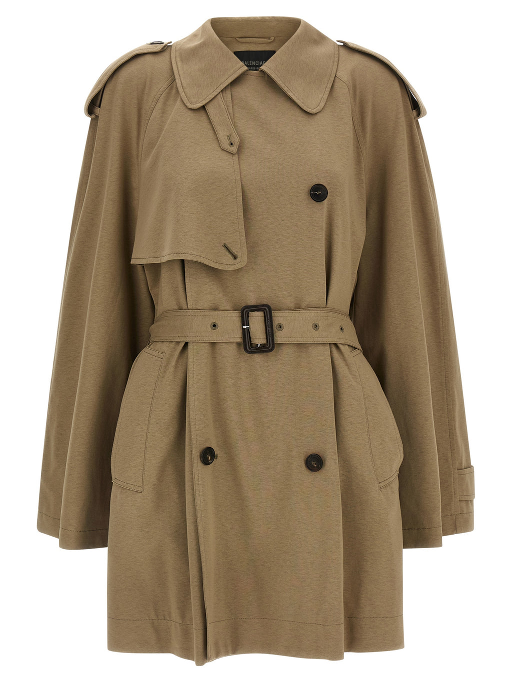 Manteau beige en coton de Balenciaga, mode élégante, visible sur un mannequin avec détails du tissu et coupe moderne.