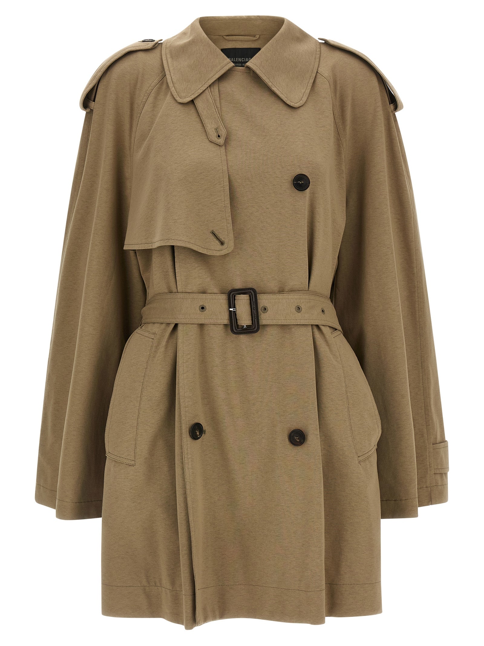 Manteau beige en coton de Balenciaga, mode élégante, visible sur un mannequin avec détails du tissu et coupe moderne.