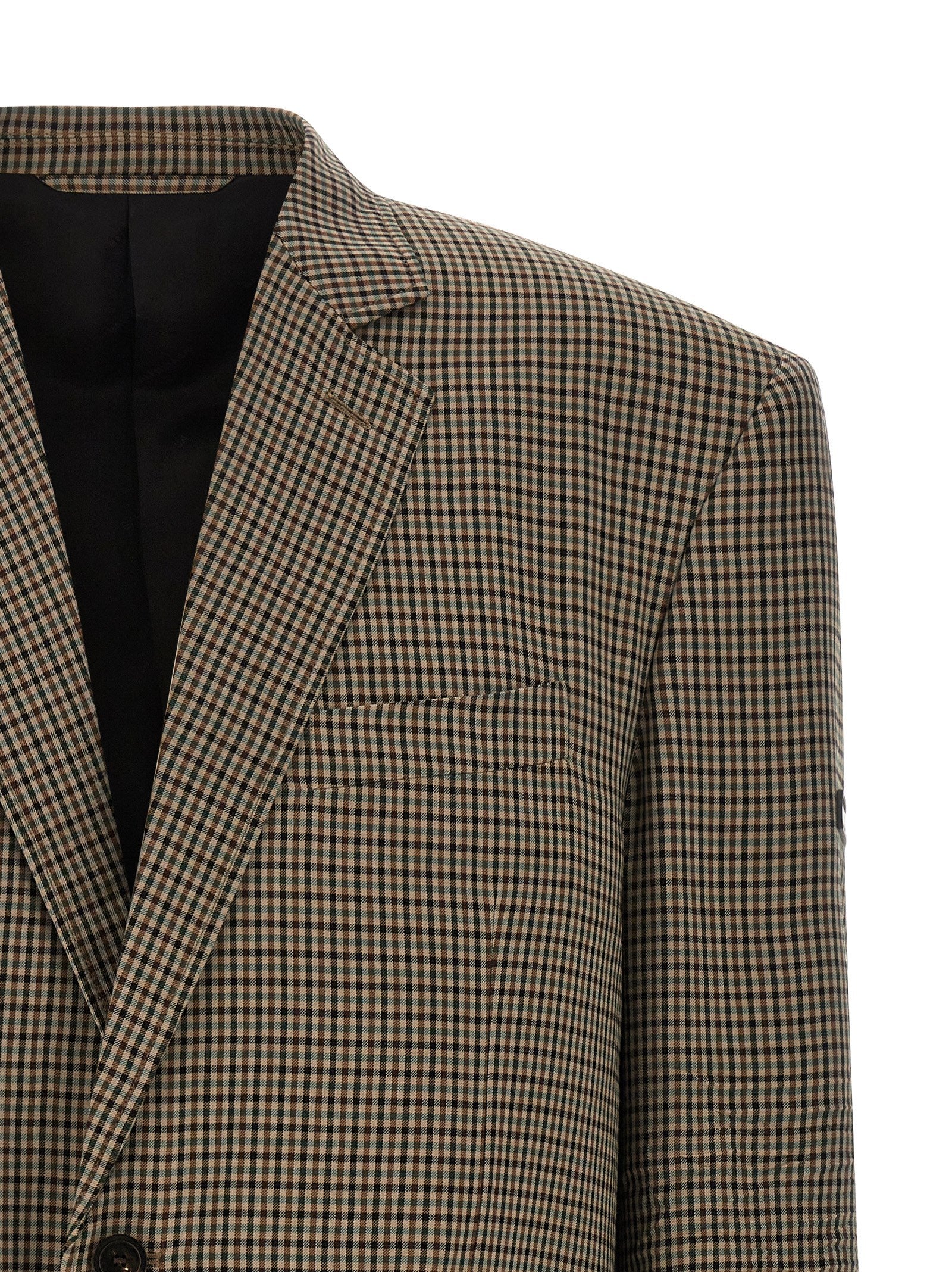Blazer marron en lyocell de Balenciaga, coupe élégante avec col et manches longues, porté ou posé sur un fond neutre.