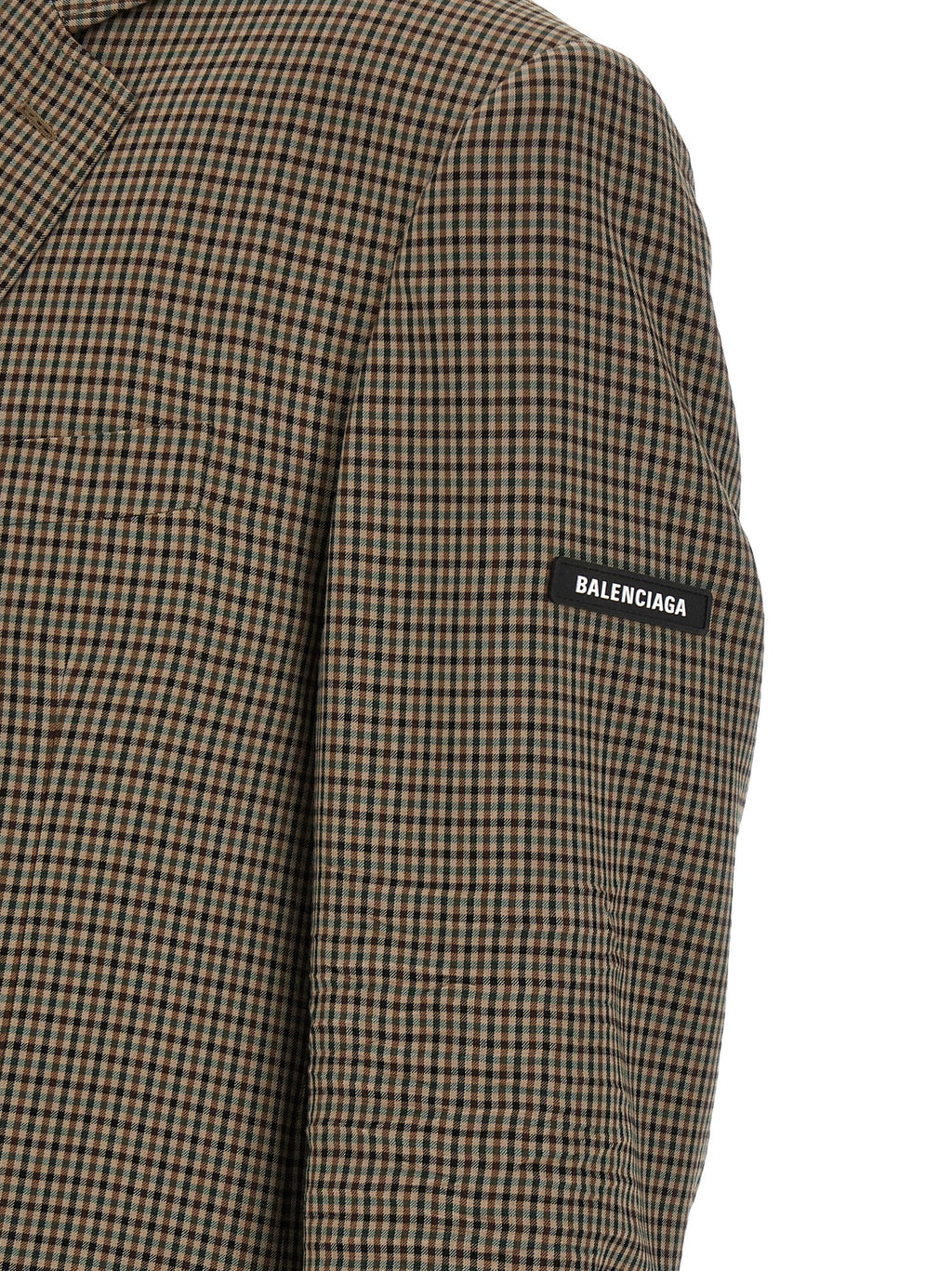 Blazer marron en lyocell de Balenciaga, coupe élégante avec col et boutonnières visibles, tissu doux et moderne.