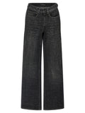 Jeans évasés en coton noir de Balenciaga, style décontracté avec coupe flare, visibles en image.
