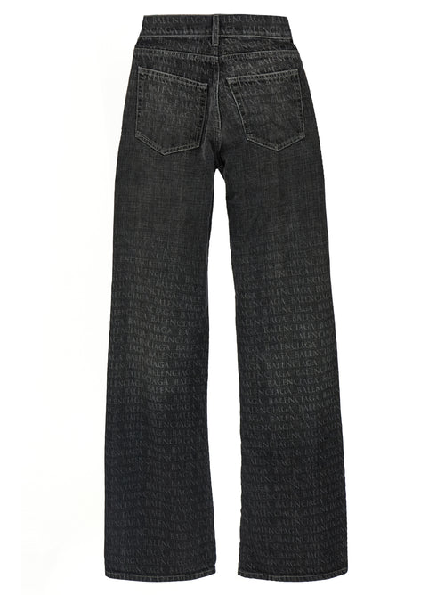 Jeans évasés en coton noir de la marque Balenciaga, coupe tendance et détail élégant.