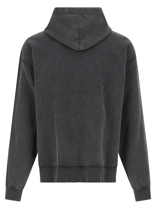 Sweatshirt en coton bicolore de Balenciaga, style décontracté avec logo visible, porté par un mannequin.