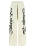 Pantalon athlétique multicolore en polyamide de Balenciaga, coupe décontractée avec détails colorés, vue de face.