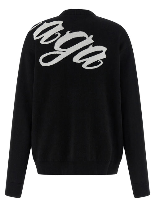 Cardigan en coton bicolore Balenciaga, coupe décontractée, détails modernes, porté sur un mannequin.