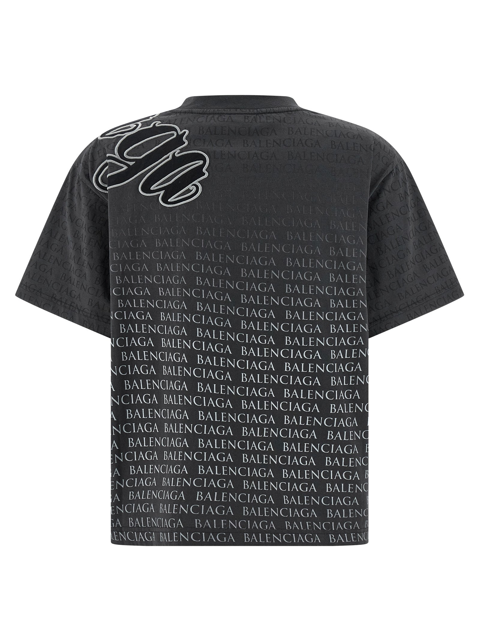 T-shirt noir en coton de la marque Balenciaga, design simple et classique avec logo discret, porté sur mannequin.