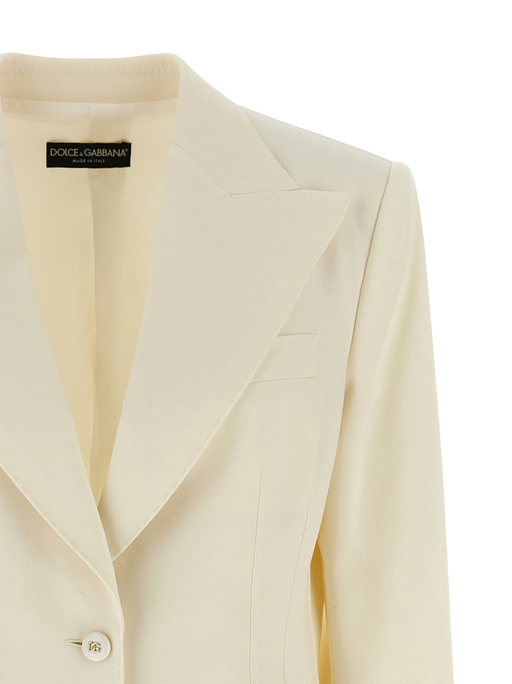 Blazer blanc en laine vierge de Dolce & Gabbana porté sur mannequin, style élégant et sophistiqué, fermeture bouton et poches latérales.