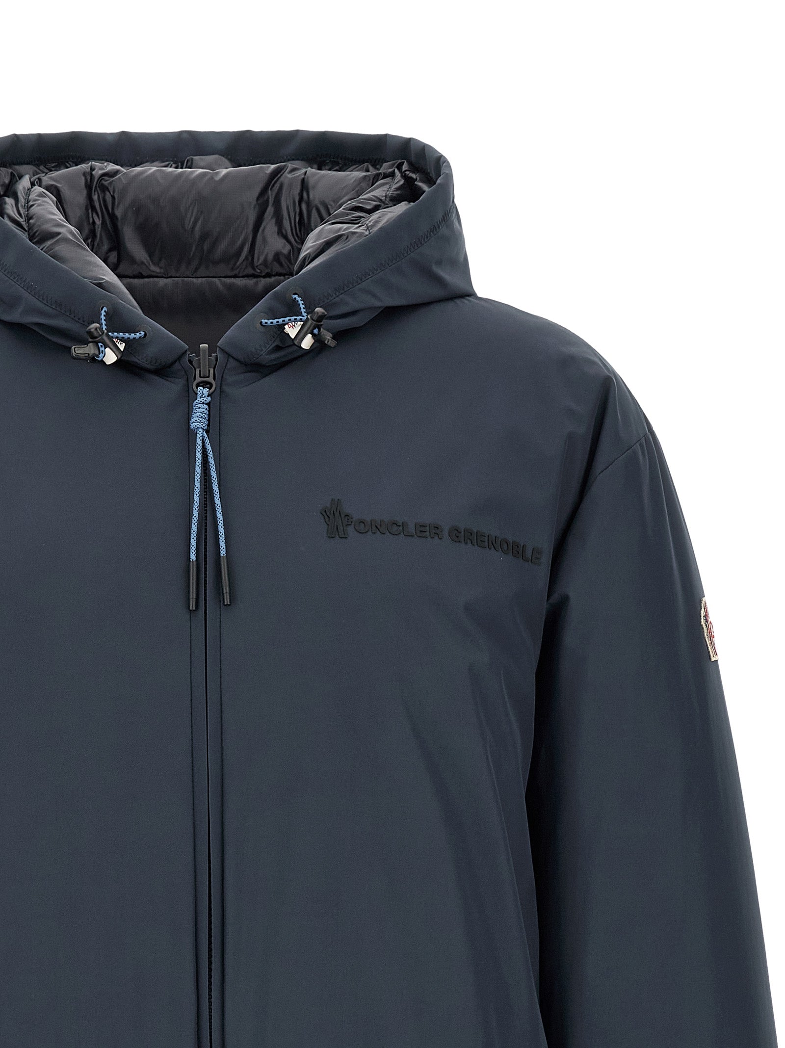 Veste Moncler Grenoble en polyamide bleu, coupe-vent et imperméable, avec capuche et fermeture éclair pour homme.
