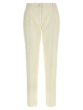 Pantalon blanc en laine vierge de Dolce & Gabbana pour femme, coupe élégante et tissu doux visible sur l'image.