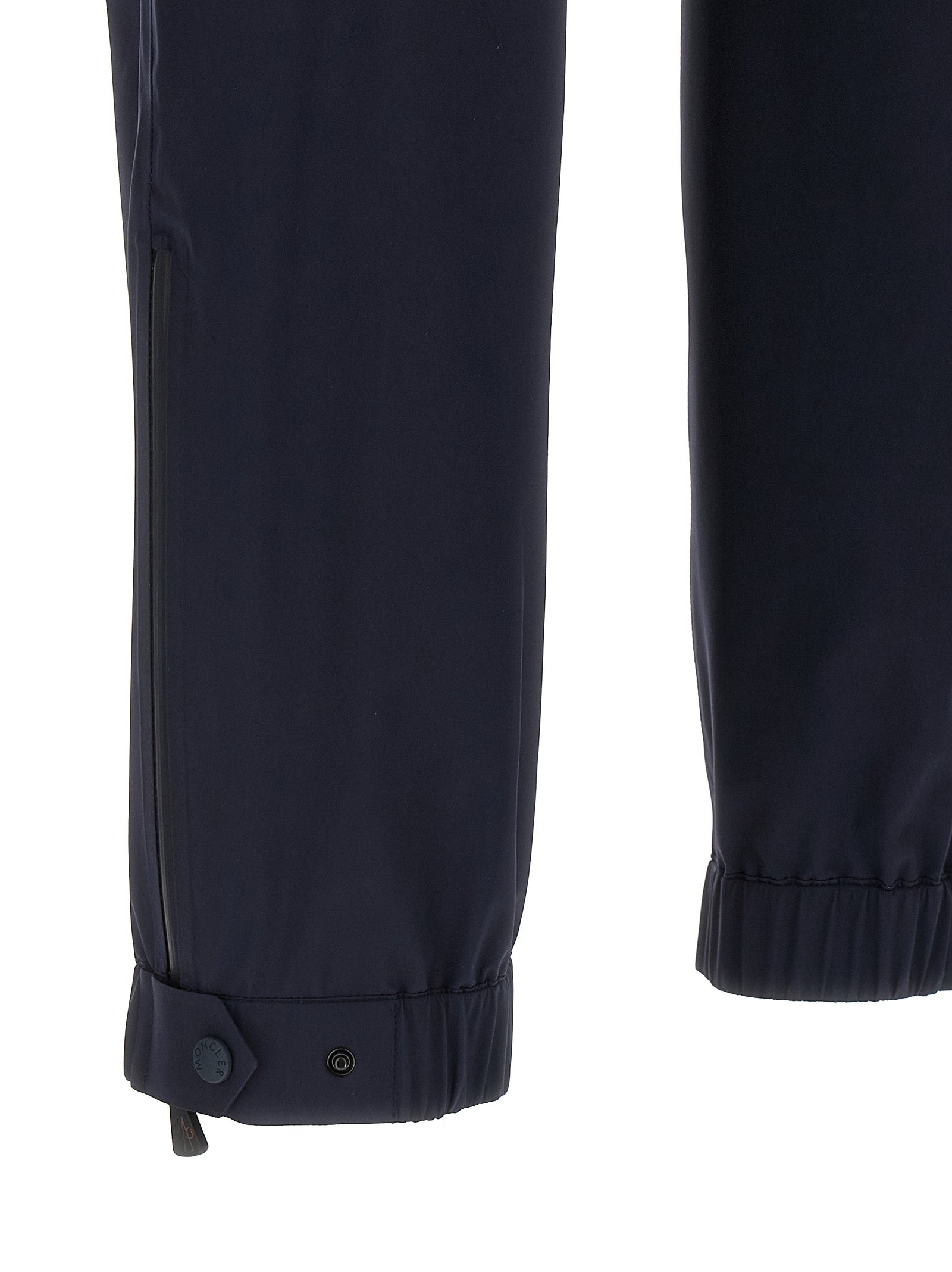 Pantalons de sport Moncler Grenoble en polyamide bleu, joggers pour l'entraînement, avec ceinture élastique et poches latérales.
