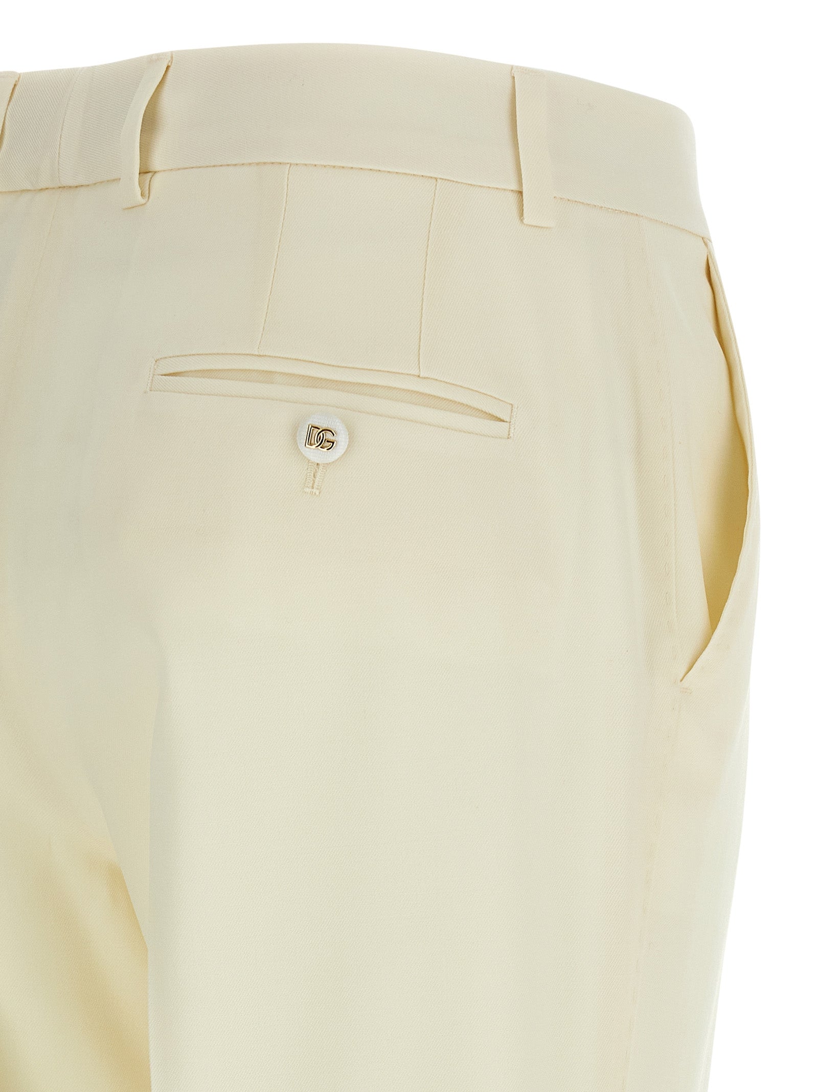 Pantalon blanc en laine vierge de Dolce & Gabbana, coupe élégante et tissu doux, pour un style sophistiqué et moderne.