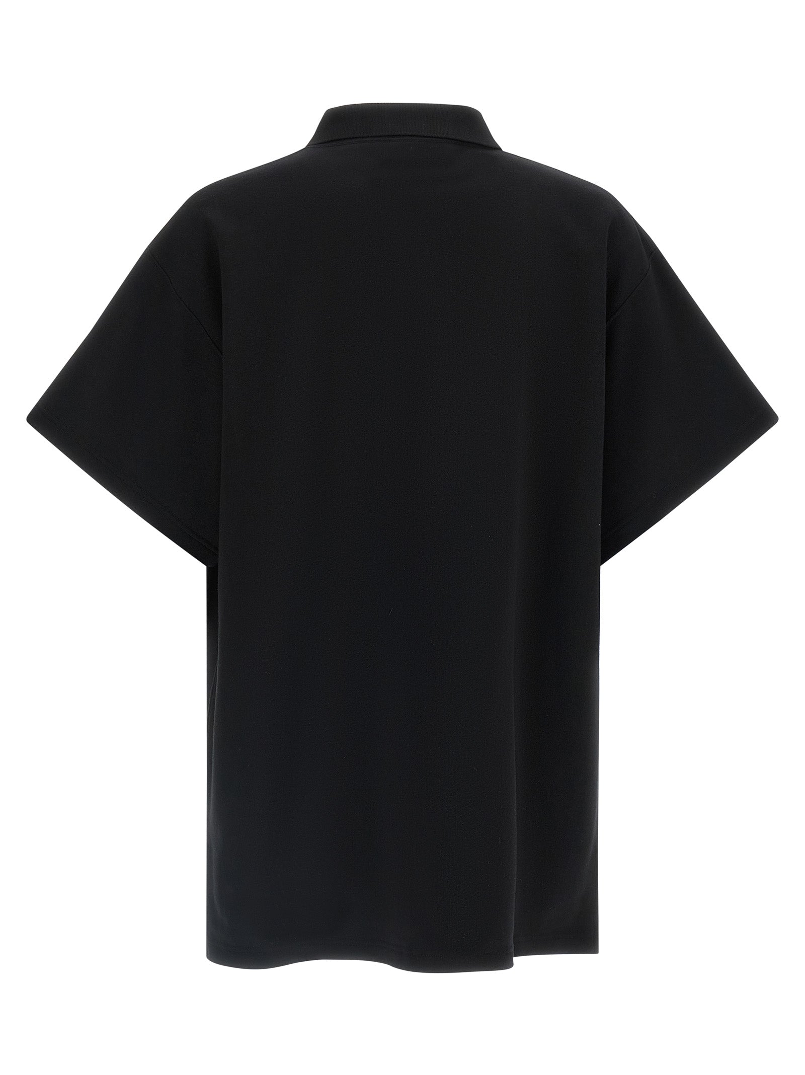 Chemise polo en coton noir de Balenciaga, classique et élégante, avec col et boutons visibles.