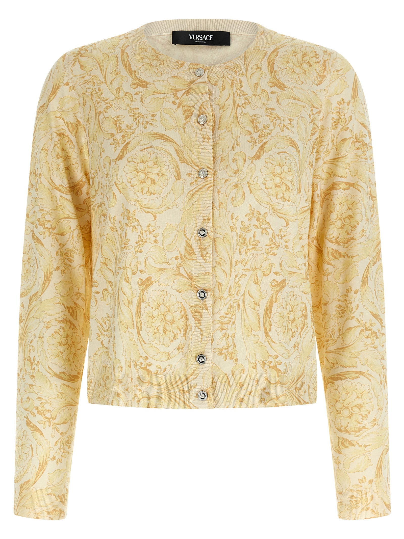 Cardigan en soie bicolore Versace avec motifs élégants, porté sur un mannequin, mettant en valeur le tissu luxueux et le design sophistiqué.