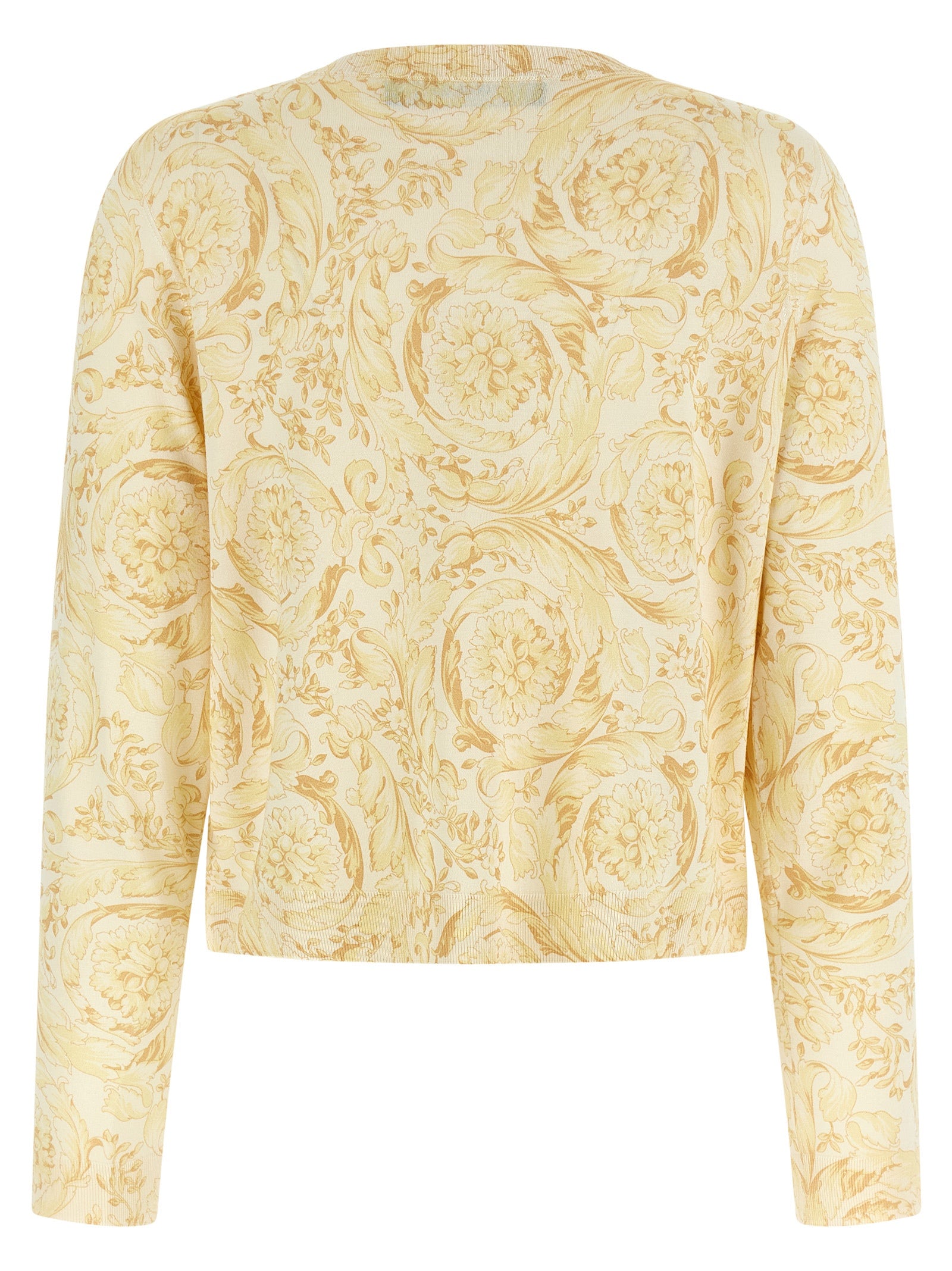 Cardigan en soie bicolore Versace porté par un mannequin, détails colorés et logo emblématique de la marque.