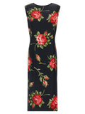 Robe midi en viscose noire de Dolce & Gabbana, élégante et fluide, portée avec des détails sophistiqués.