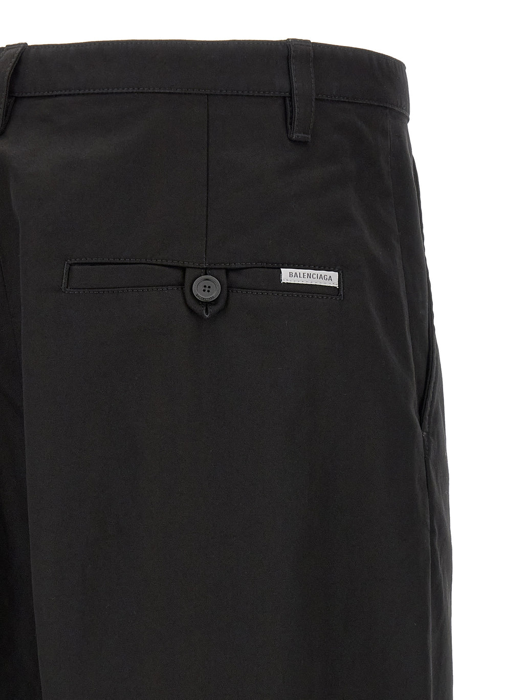 Pantalon chino noir en coton de la marque Balenciaga, coupe classique avec détails modernes, visible en image.