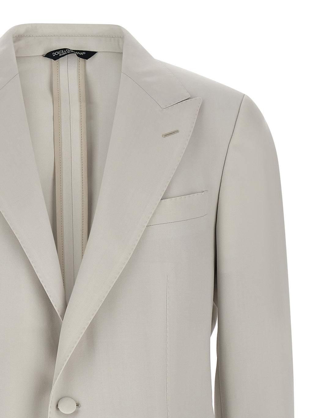 Blazer en laine vierge gris de Dolce & Gabbana, veste élégante pour homme ou femme avec coupe classique et détails sophistiqués.