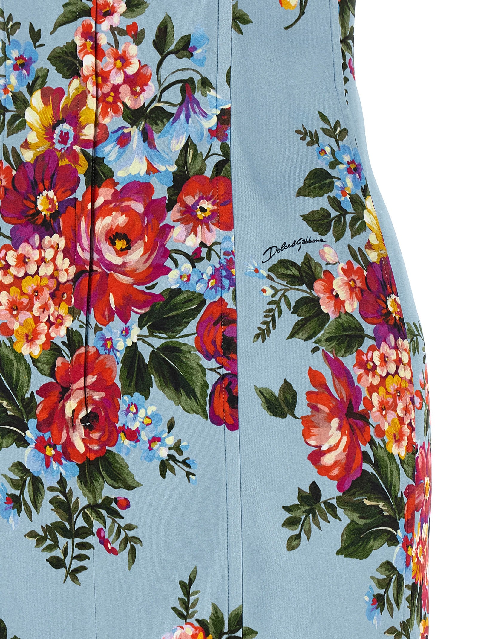Robe midi en viscose bleue de Dolce & Gabbana, coupe élégante, avec détails raffinés, portée sur un fond neutre.