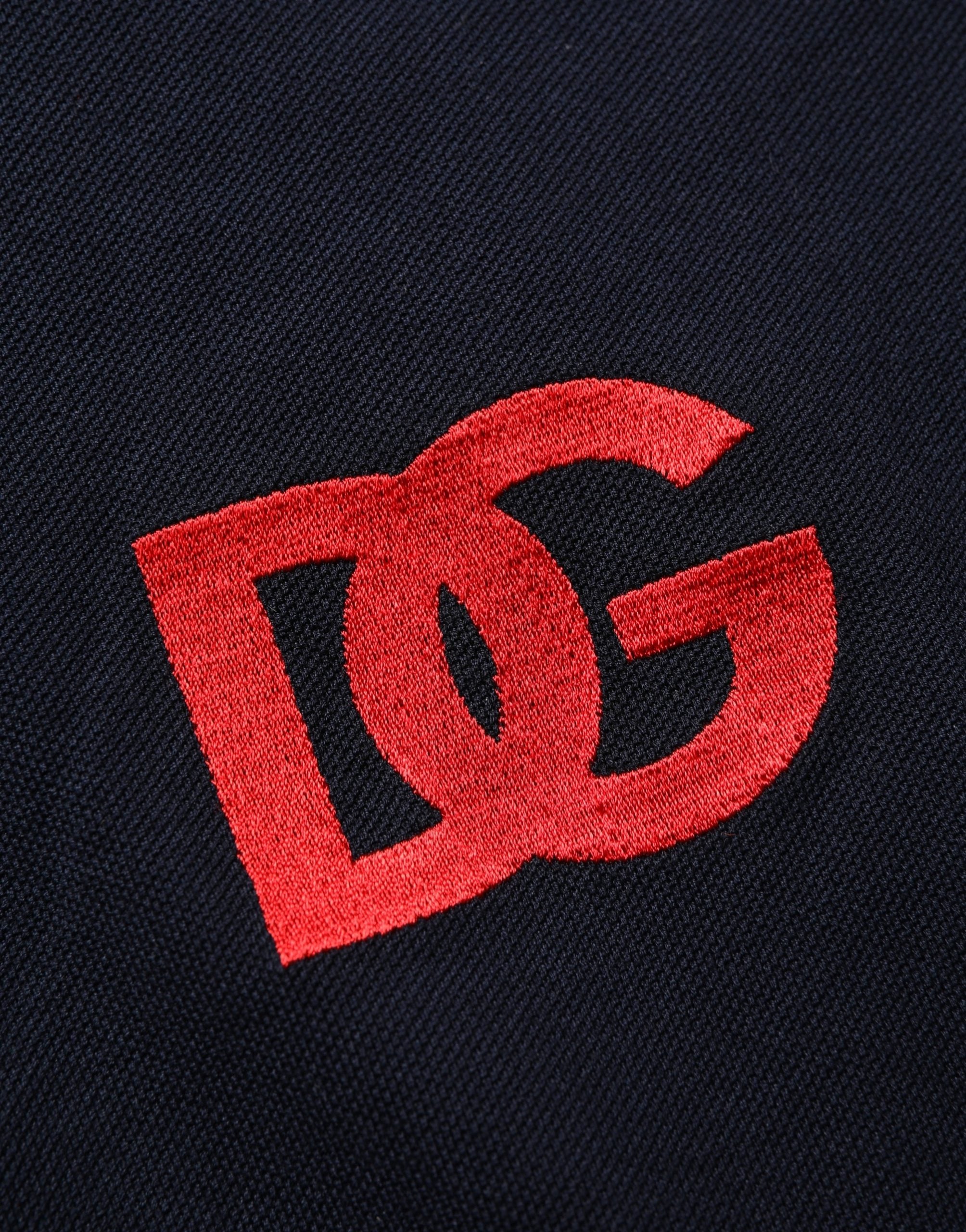 Polo à manches courtes noir Dolce & Gabbana avec logo DG imprimé, tissu doux et coupe classique.