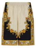 Shorts bermuda en soie multicolore de Versace, style élégant avec motifs vibrants, pour un look sophistiqué et tendance.