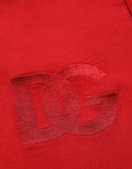 Sweat à capuche Dolce & Gabbana rouge brodé avec logo, zip complet, en coton, porté sur mannequin.