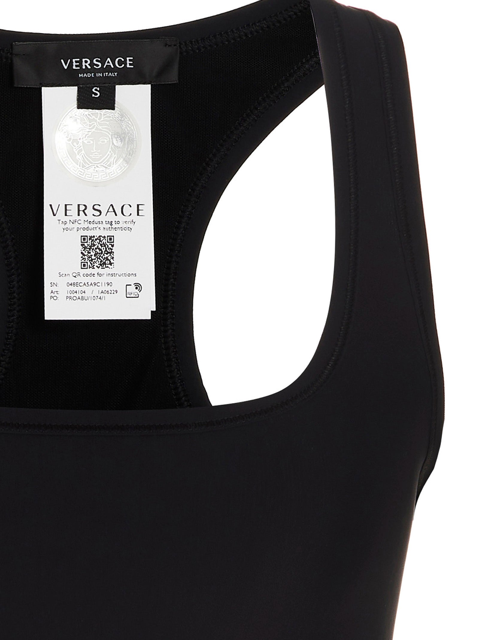 Soutien-gorge de sport noir en polyamide de Versace, avec design élégant et détails modernes visible sur l'image.