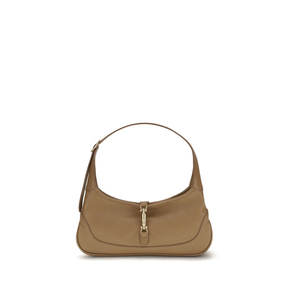 Sac à main Gucci beige en cuir de chèvre, élégant et sophistiqué, avec détails raffinés et finition de haute qualité.