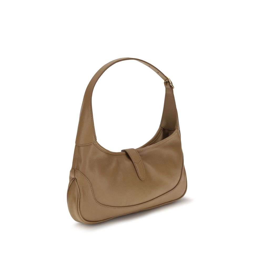 Sac à main Gucci en cuir de chèvre beige, élégant et sophistiqué, avec détails raffinés et finition de haute qualité.
