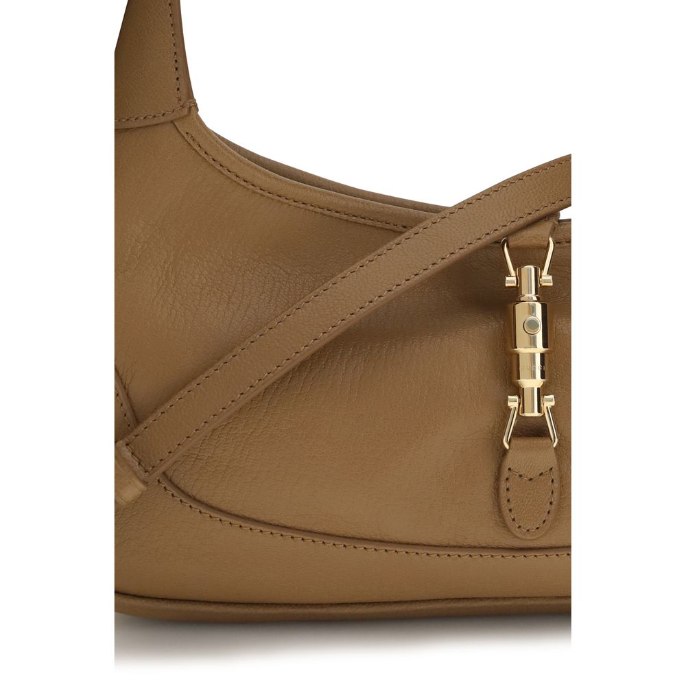 Sac à main en cuir de chèvre beige Gucci, élégant et artisanal, avec détails raffinés visibles sur l'image.