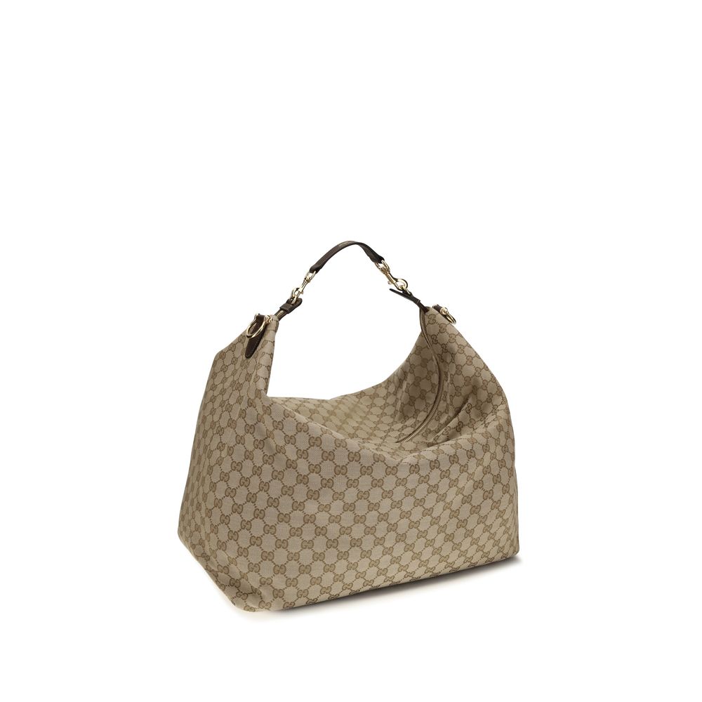 Sac Gucci beige en tissu avec bandoulière, élégant et spacieux, parfait pour un style sophistiqué.