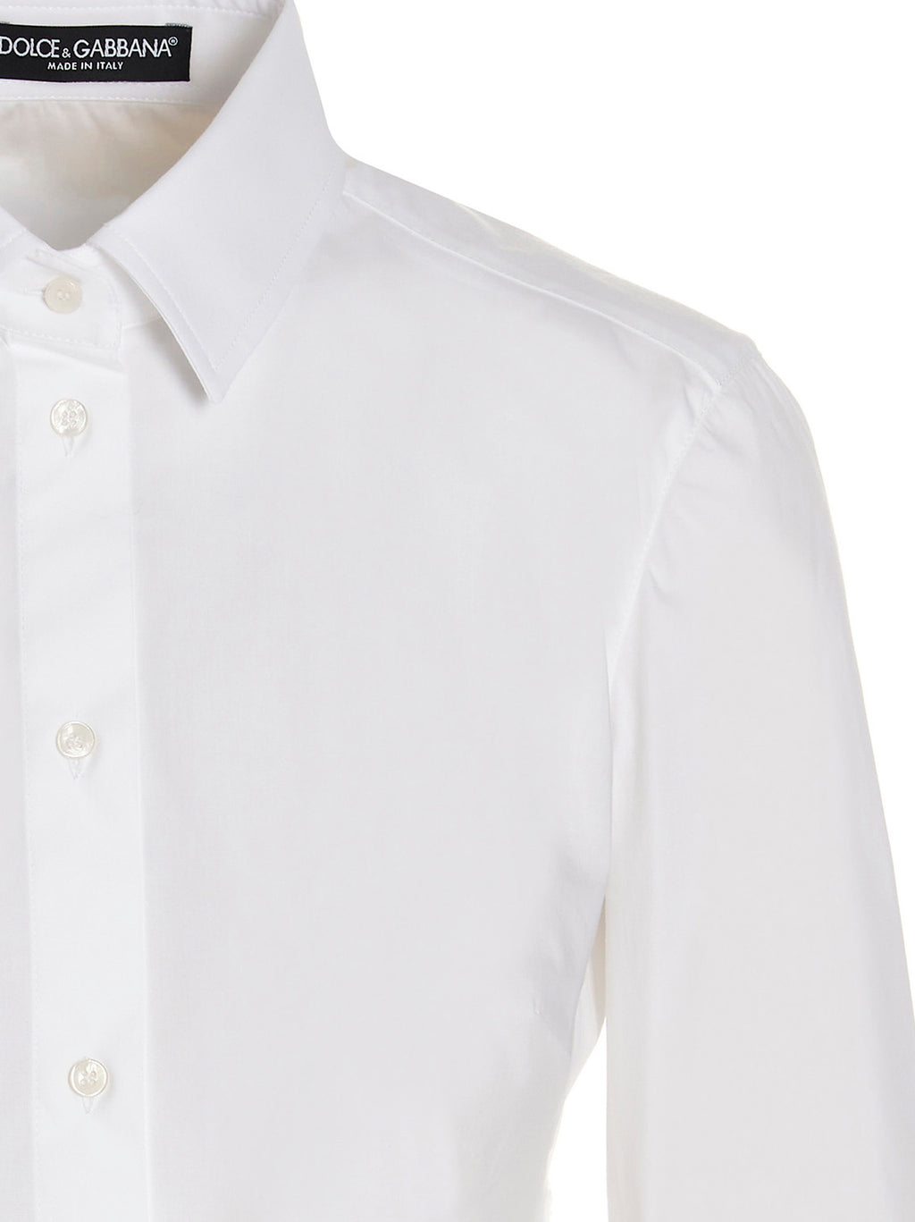 Haut en coton blanc Dolce & Gabbana, blouse élégante avec détails fins, manches longues et coupe classique visible sur l'image.