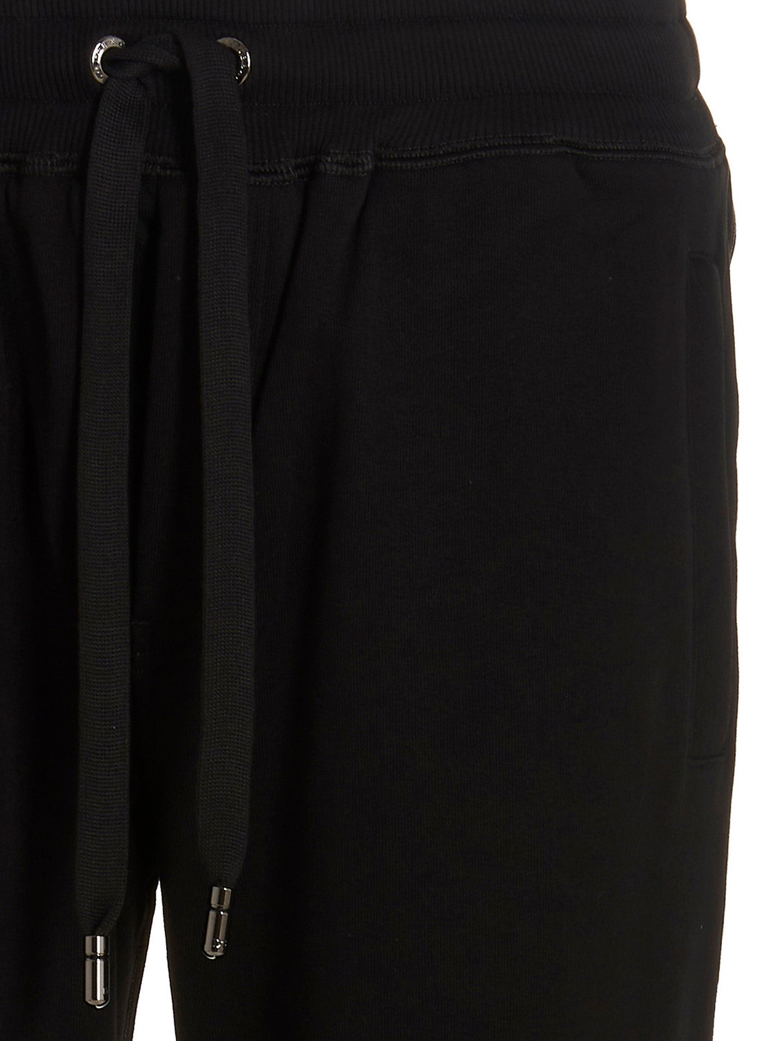 Pantalons de jogging en coton noir Dolce & Gabbana pour homme, style décontracté et confortable, visible sur l'image.