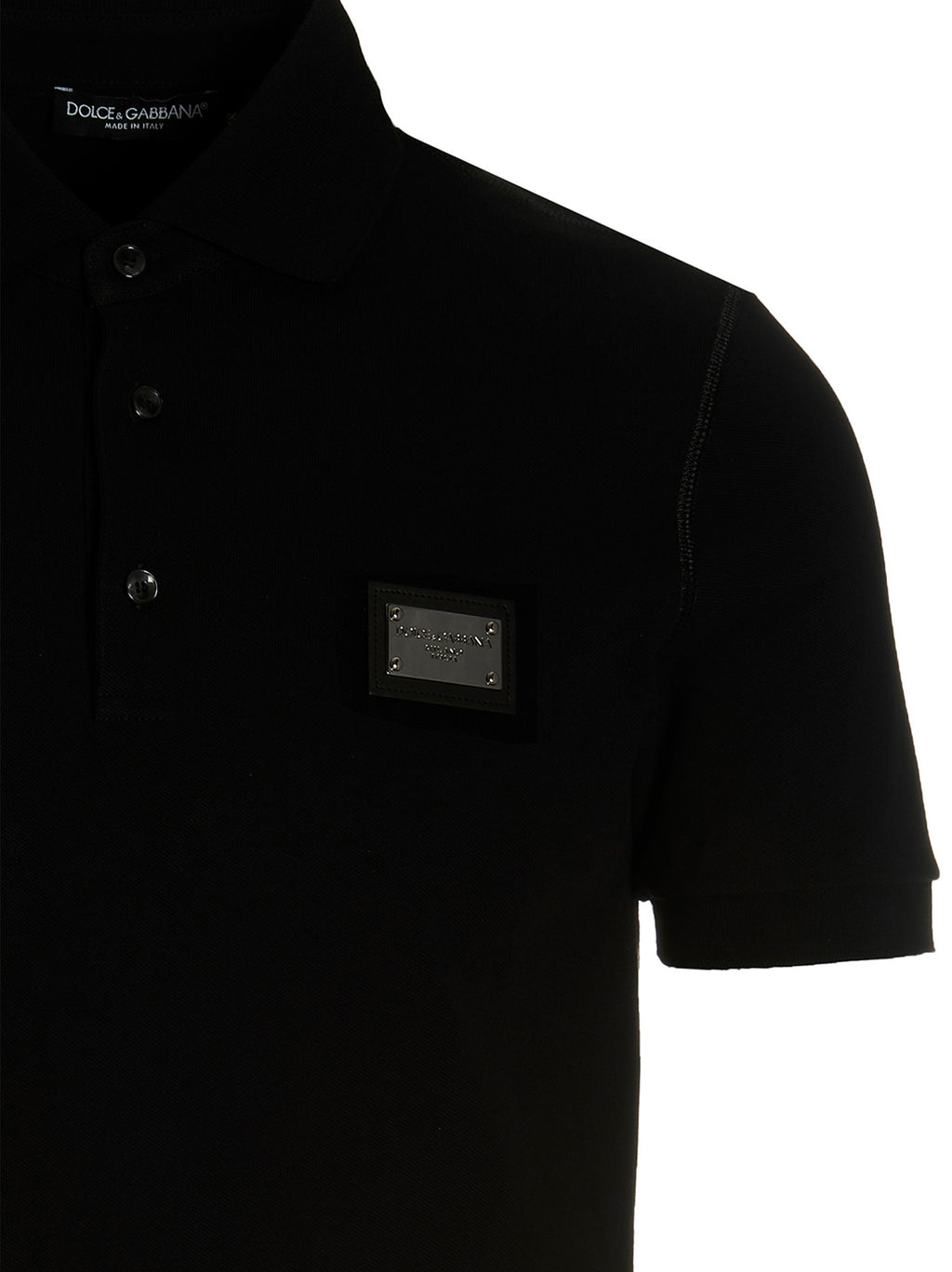 Chemise polo en coton noir de Dolce & Gabbana, vue de face, avec col classique et logo discret sur la poitrine.