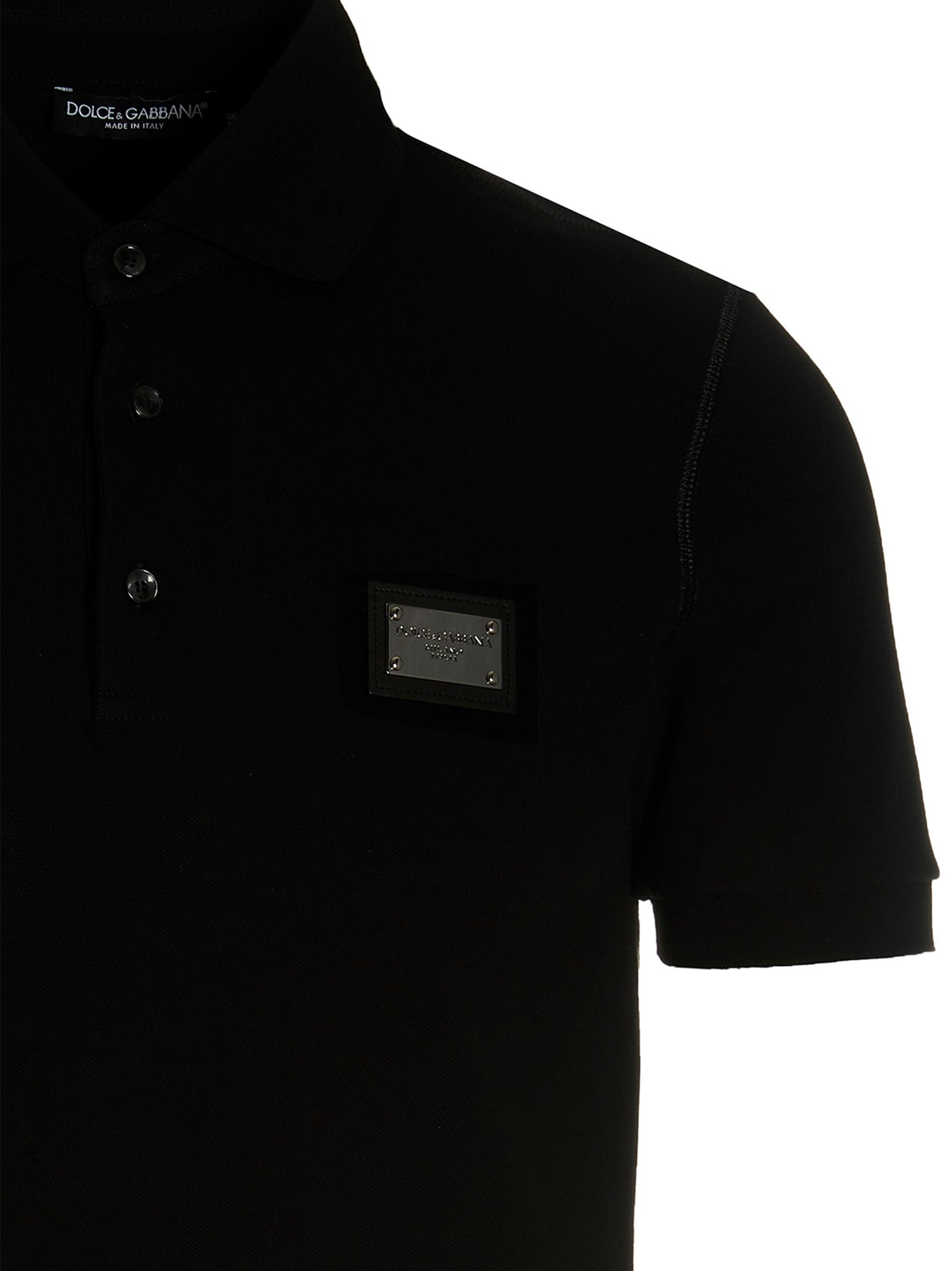 Chemise polo en coton noir de Dolce & Gabbana, vue de face, avec col classique et logo discret sur la poitrine.