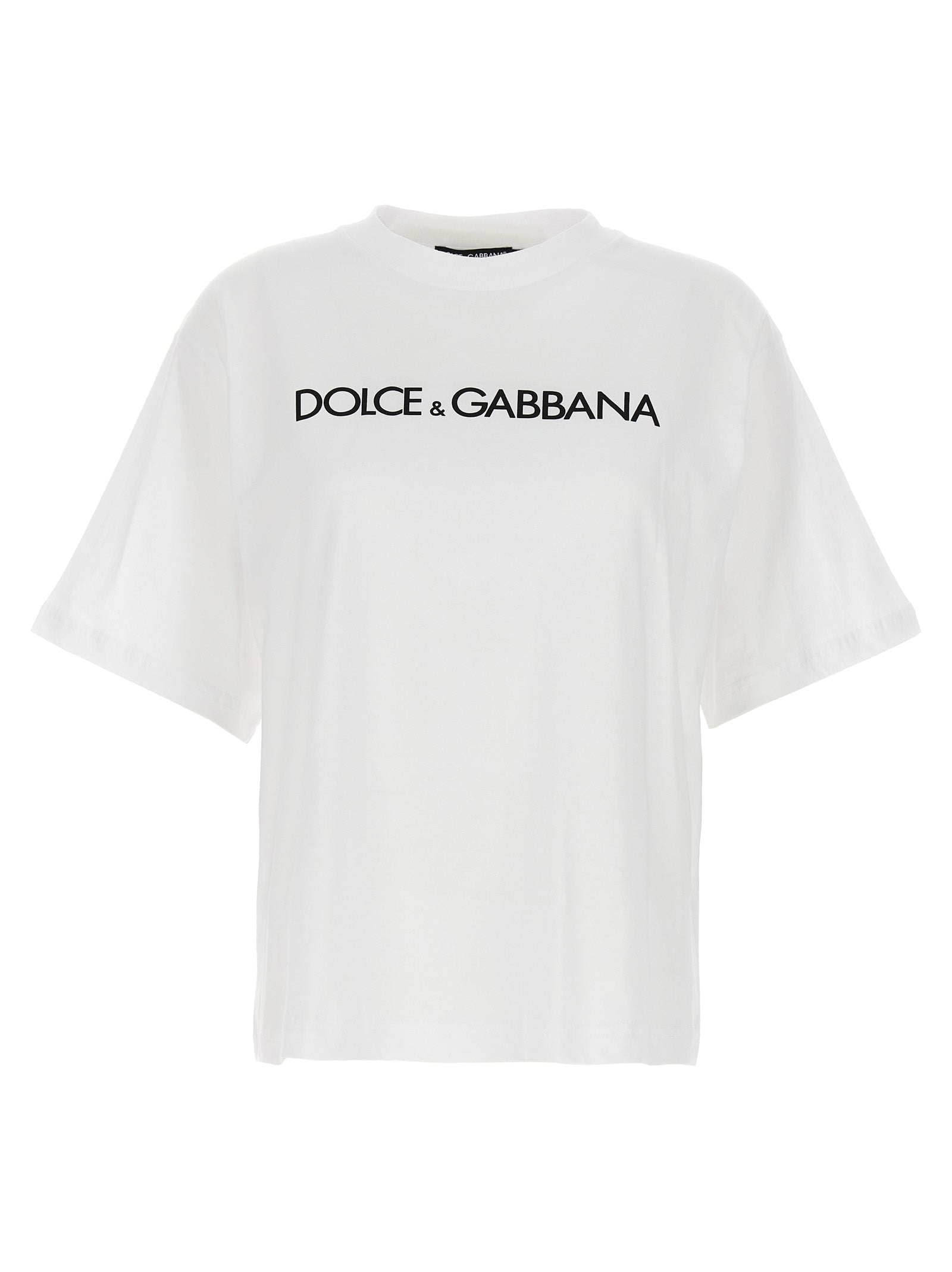 T-shirt blanc en coton de Dolce & Gabbana, coupe classique, avec logo discret sur la poitrine, porté sur mannequin.