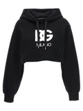 Sweat à capuche en coton noir Dolce & Gabbana avec logo brodé, style décontracté et moderne, porté en image.