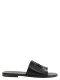 Sandales en cuir noir Dolce & Gabbana, slides élégantes avec bride large, parfaites pour un style sophistiqué et confortable.