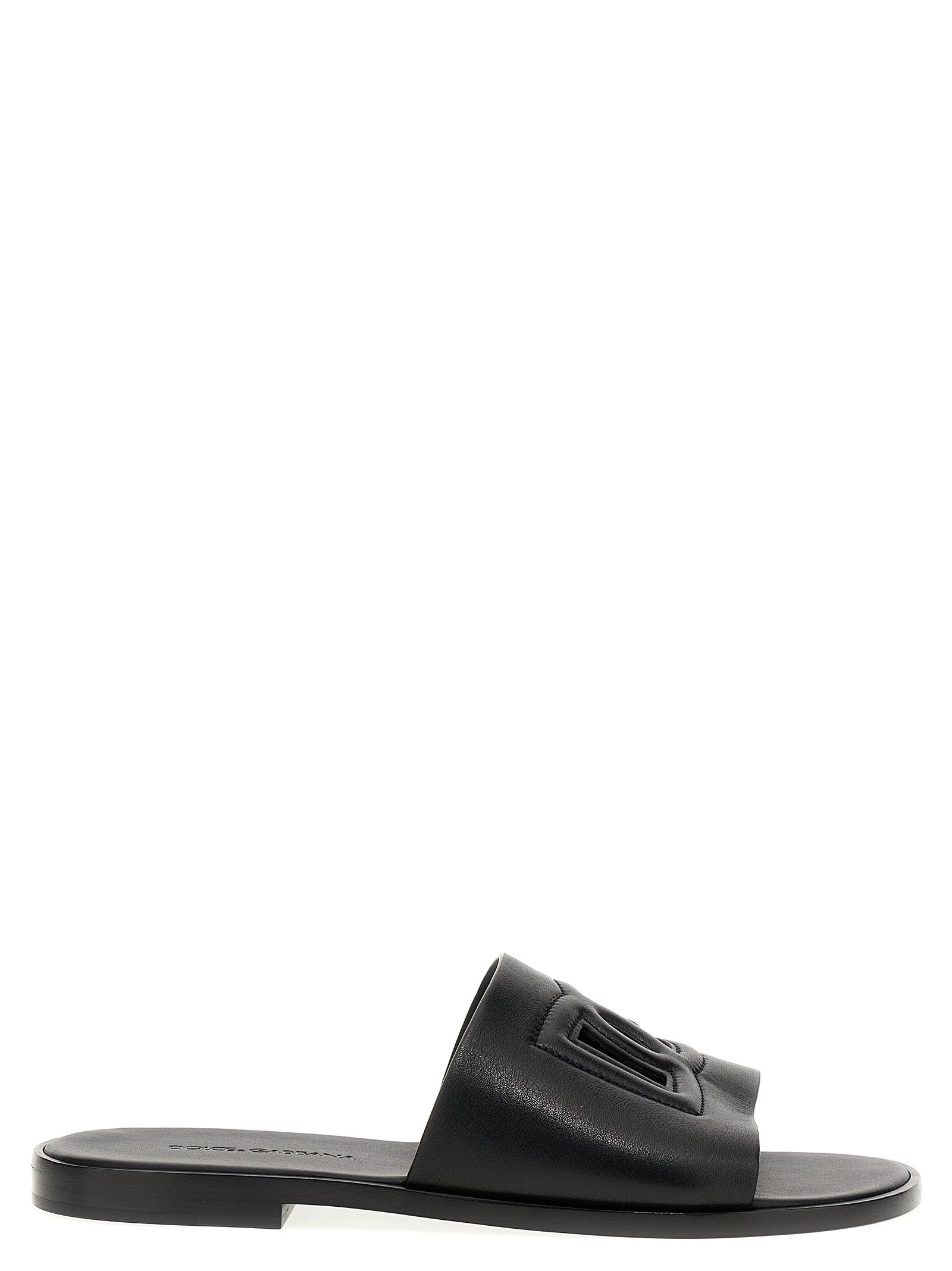 Sandales en cuir noir Dolce & Gabbana, slides élégantes avec bride large, parfaites pour un style sophistiqué et confortable.