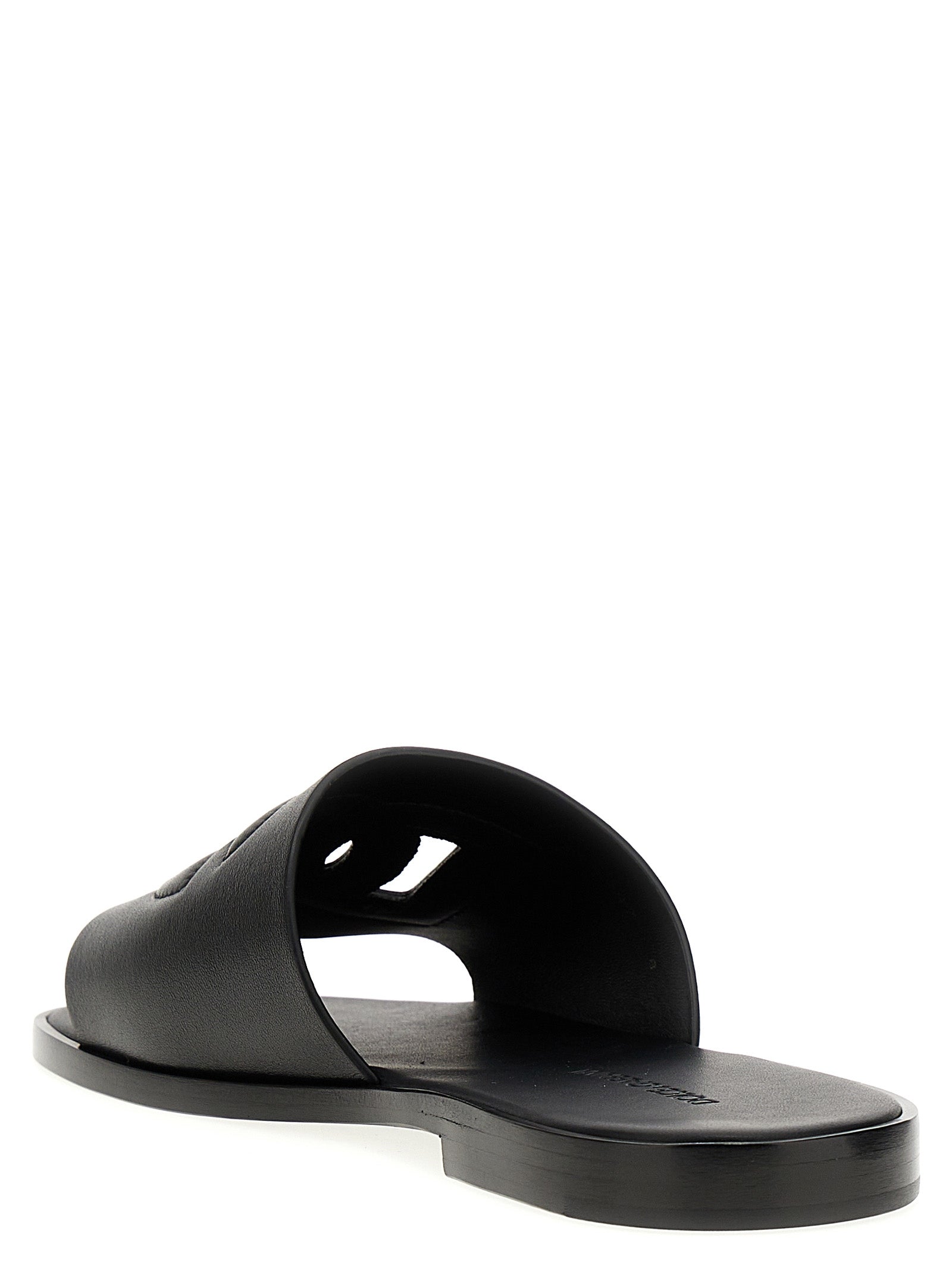 Sandales en cuir noir Dolce & Gabbana, élégantes et confortables, avec design épuré et logo de la marque visible.