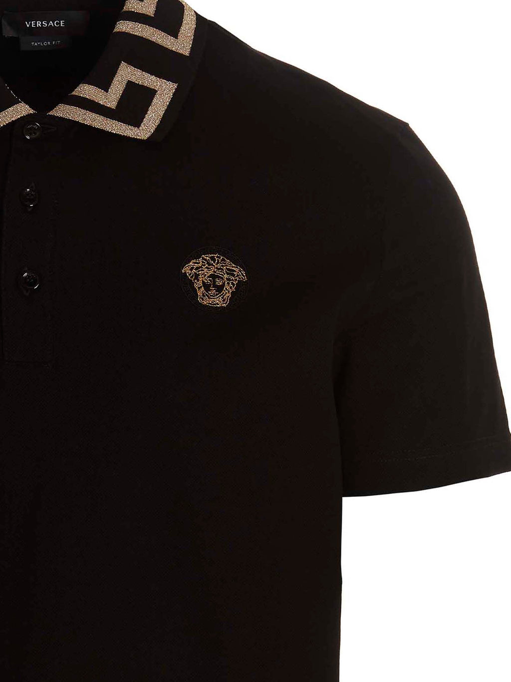 Chemise polo en coton noir de la marque Versace, vue de face, avec logo distinctif sur la poitrine.