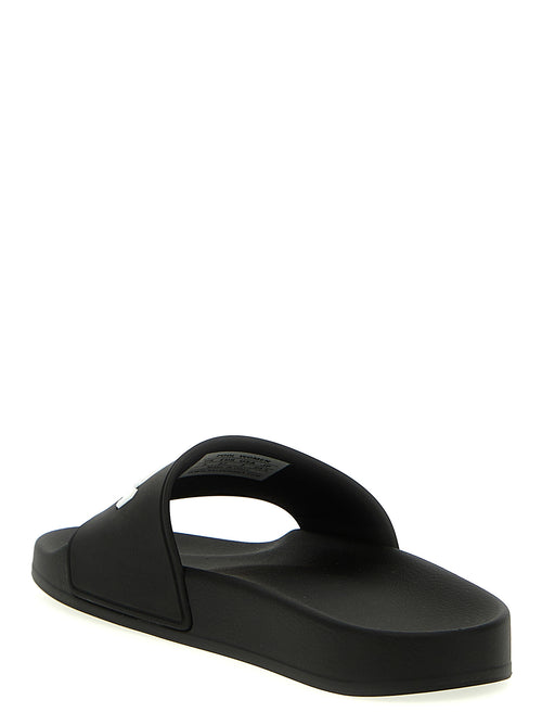 Sandales Bicolor en plastique Balenciaga, vue rapprochée montrant la texture brillante et le design moderne.
